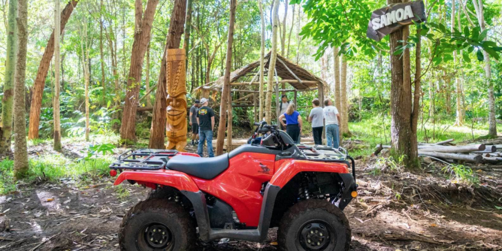 A red ATV parked in front of Aloha Adventure Farms