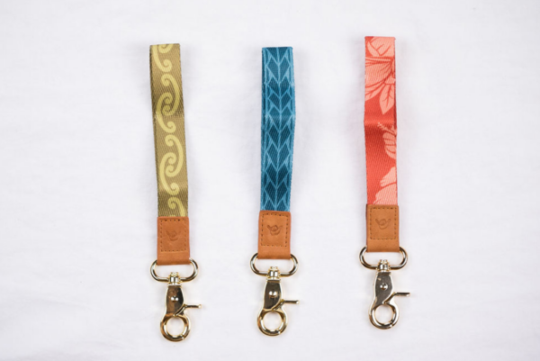 Three minimalist lanyards side-by-side: Green Strength, Blue Courage, Hibiscus Loyalty