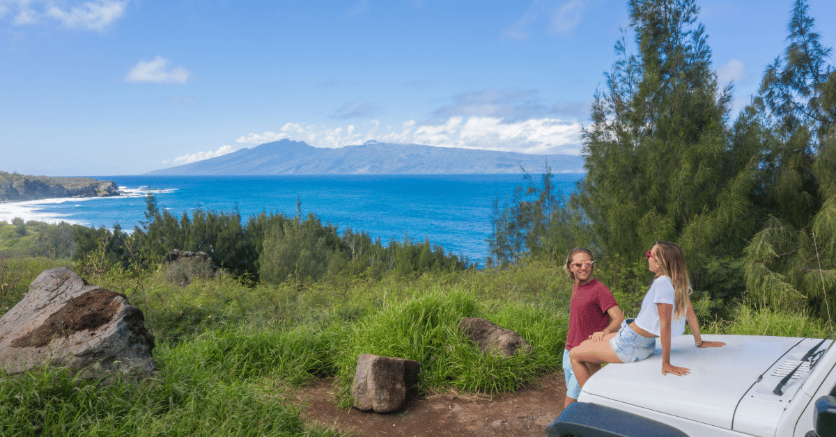 two people in a hawaii rental car